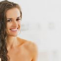 woman moisturize her hair